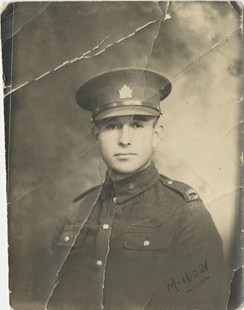 A young white man, Private Jim Stone, wearing a Canadian military uniform from the early 1930s.