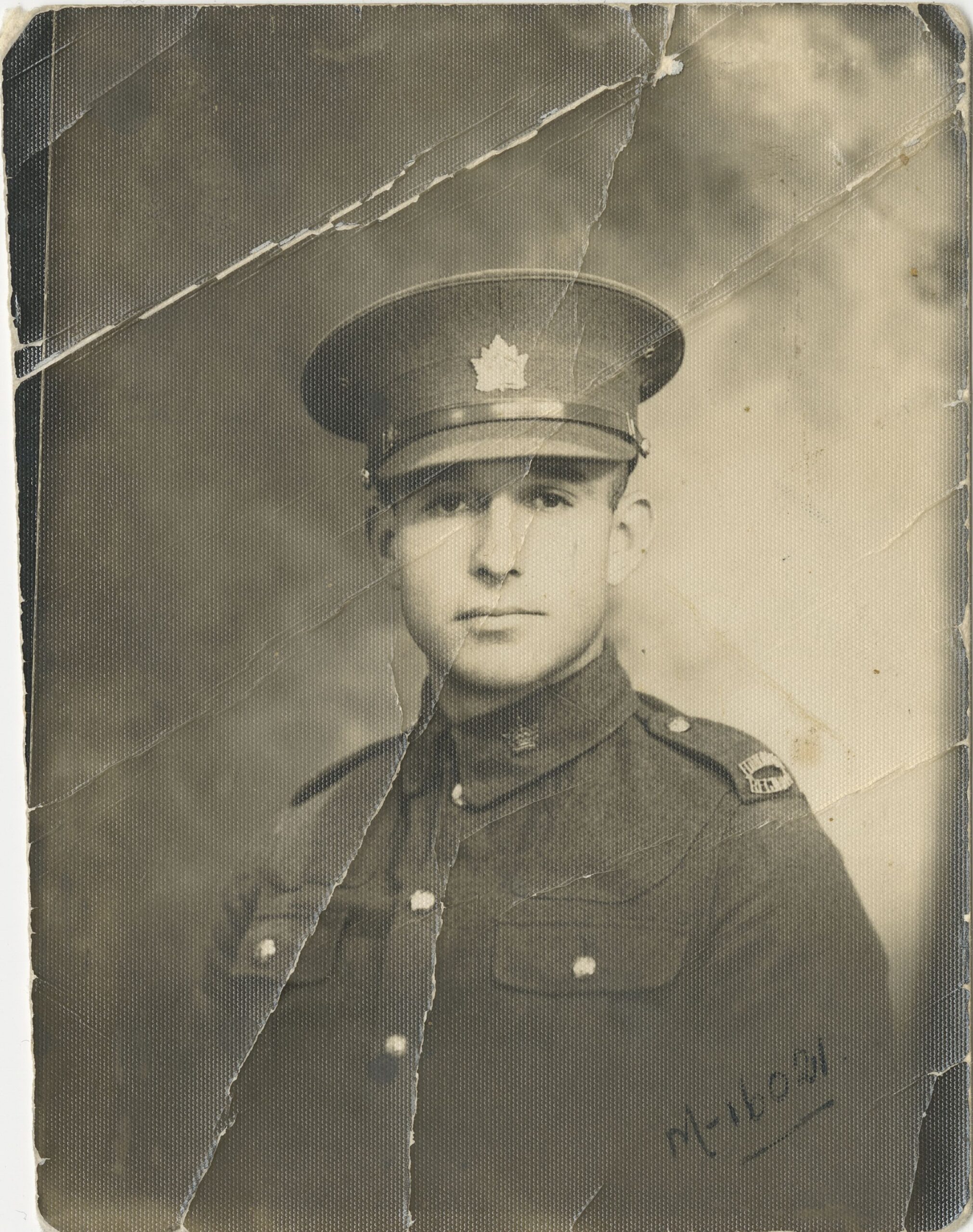 A young white man, Private Jim Stone, wearing a Canadian military uniform from the early 1930s.