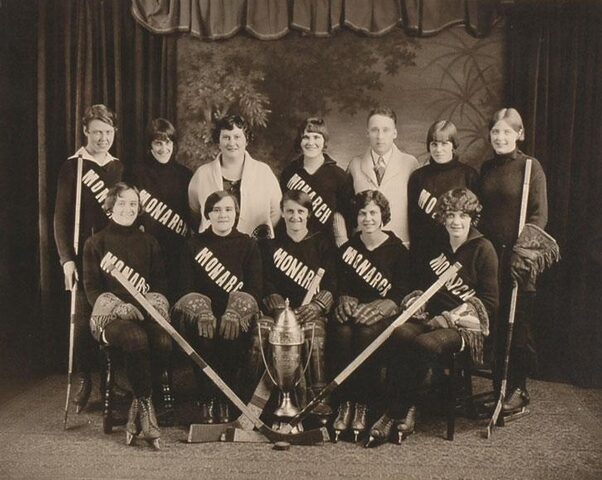 A 1920s women’s hockey team, the Edmonton Monarchs, poses with a trophy, the 1928 Misener Cup.
