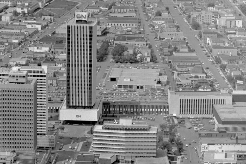 Aerial photograph of Edmonton's downtown, with the CN Tower clearly larger than the buildings around it.