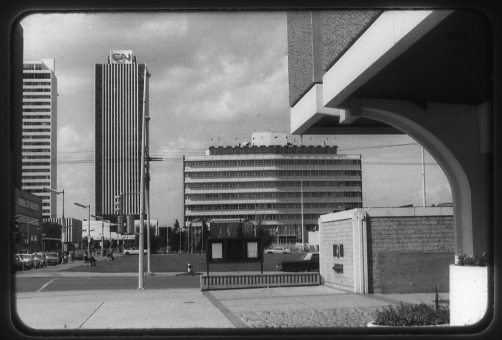 Black and white photo of buildings in downtown Edmonton, including the CN Tower and Edmonton's former City Hall.