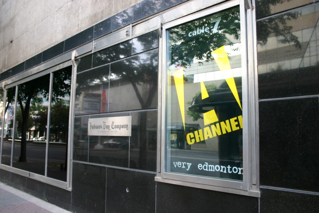 Exterior of A-Channel sign in window of old Bay Building on Edmonton’s Jasper Avenue, taken in July 2005