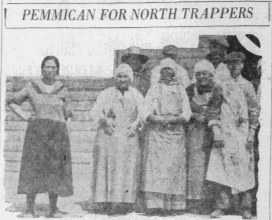 A photo from a newspaper article of a small group of people in aprons. The headline says Pemmican for North Trappers.