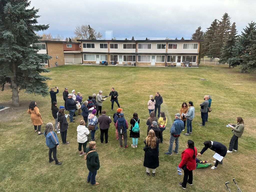 Gathering on the Garden Court courtyard grass.